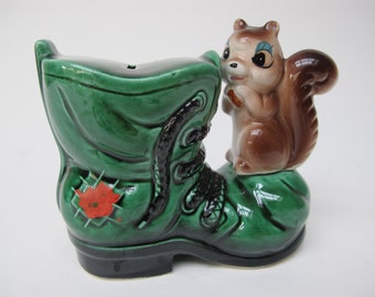 Squirrel piggy bank and green shoe