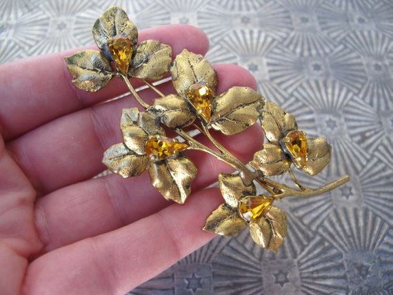 Large gold metal brooch, flower stem - image 6