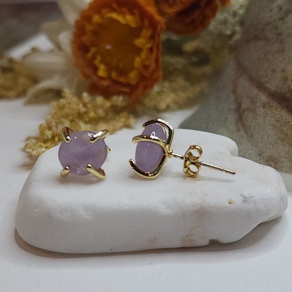 Raw Amethyst Stud Earrings with gold four prong harness.