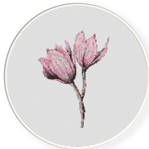 May include: A cross-stitch pattern featuring two pink magnolia flowers with a stem and leaves on a white background.