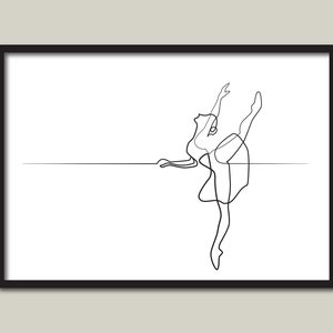 May include: Black framed art print with a minimalist line drawing of a ballerina in a graceful pose. The artwork shows a dancer with one leg extended, arms raised, and a simple skirt. The background is white.
