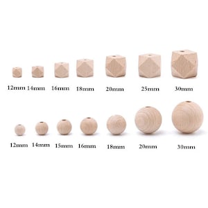 May include: Assortment of wooden beads in various sizes, ranging from 12mm to 30mm. The beads are round and have a natural wood finish.