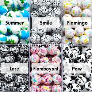May include: Six containers of colourful silicone beads for jewellery making. The containers are labelled "Summer", "Smile", "Flamingo", "Lace", "Flamboyant", and "Paw".