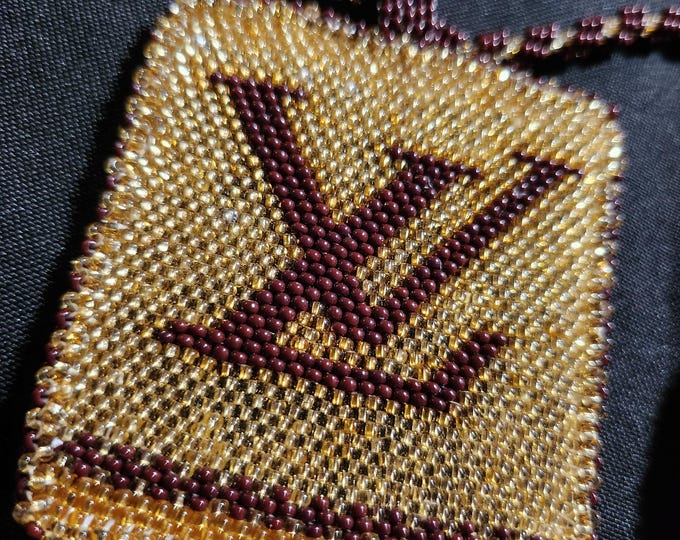 Tribal member of the Colville Confederated Tribes beaded