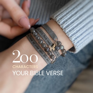 Può includere: Braccialetto avvolgente grigio con una sezione di perline e un ciondolo a farfalla. Il braccialetto ha il testo "Take my yoke upon you and..." e "...will find rest." L'immagine include anche il testo "200 CHARACTERS YOUR BIBLE VERSE."