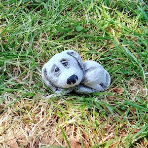 Small stone dog figure for the garden weatherproof