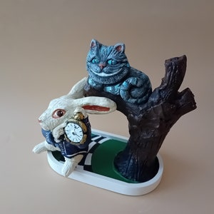 Cheshire Cat figure from Alice in Wonderland decoration bowl on tree trunk