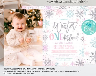 May include: Editable 5x7 winter wonderland first birthday party invitation with a snowflake theme. The invitation features a photo of a baby girl, a silver glitter font, and a pink and blue snowflake design. The text on the invitation reads "Join us in a Winter Wonderland, our little snowflake Brittany Sophia is turning one!"