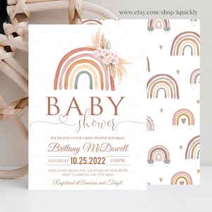 May include: A baby shower invitation with a watercolor rainbow design in shades of pink, orange, and brown. The invitation features the text "BABY shower" and includes the date, time, and location of the event. The text "Registered at Amazon and Target" is also included.