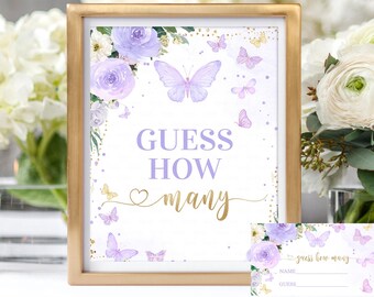 May include: Purple and gold butterfly themed printable game card with the text "Guess How Many" and a floral design. The card is framed in gold and has a matching smaller card with the text "Guess How Many" and spaces for a name and guess.