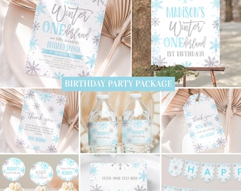 May include: Winter Wonderland themed birthday party printable package featuring a blue and silver snowflake design. Includes invitations, thank you cards, water bottle labels, cupcake toppers, a banner, and a welcome sign. The text on the sign reads "Madison's Winter Wonderland 1st Birthday".