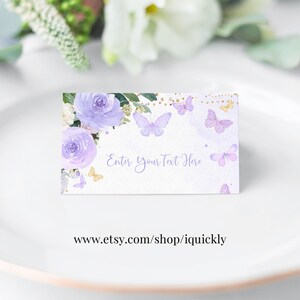 May include: Purple and gold floral place card with butterflies and the text "Enter Your Text Here".