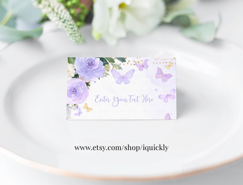 May include: Purple and gold floral place card with butterflies and the text "Enter Your Text Here".