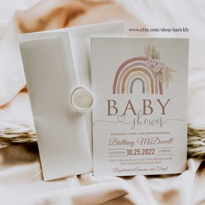 May include: A baby shower invitation with a watercolor rainbow design in shades of pink, orange, and blue. The text reads "Baby shower" and includes the name "Brittany McDowell" and the date "10.25.2022".