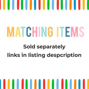 May include: A white rectangular sign featuring a border of vertical multicolored stripes in blue, green, yellow, orange, and red. The text reads MATCHING ITEMS in large colorful letters, followed by Sold separately links in listing despcription.