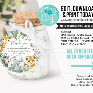 May include: A round, white thank you tag with a watercolor illustration of jungle animals, green leaves, and the text "thank you for showering our baby with love Brittany's Baby Shower November 20th, 2021".