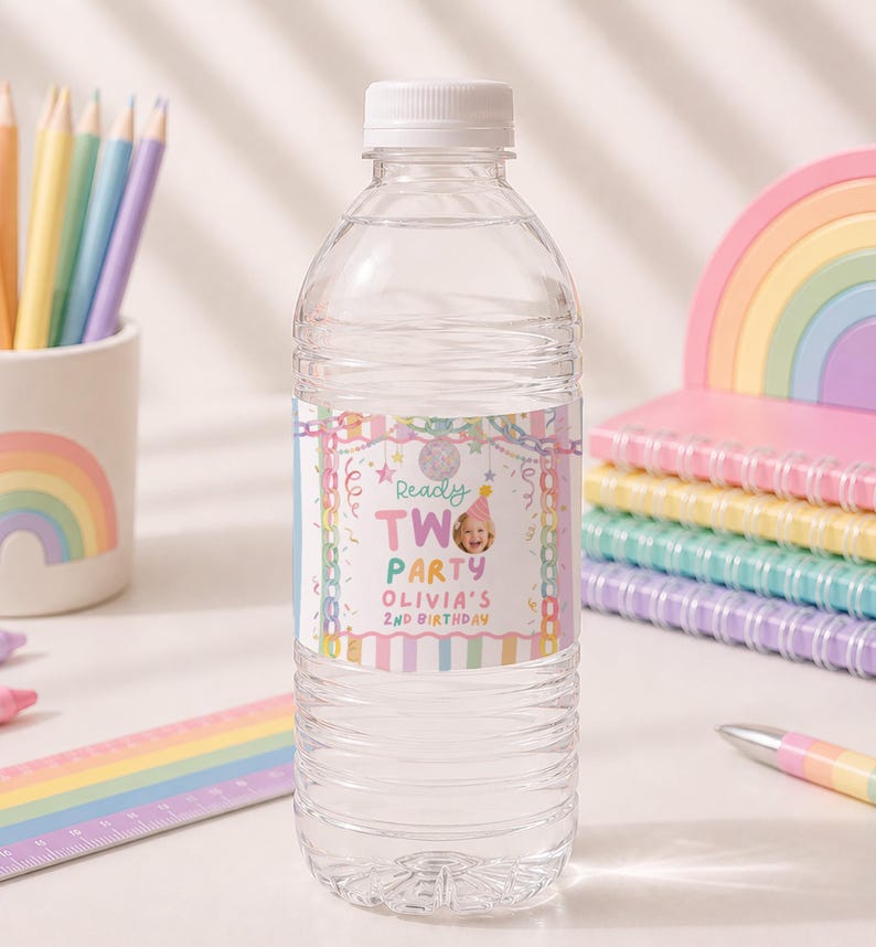 May include: A clear plastic water bottle with a custom label featuring pastel stripes, confetti, and the text Ready TWO PARTY OLIVIA'S 2ND BIRTHDAY, including a small circular photograph of a child wearing a pink party hat on the label.