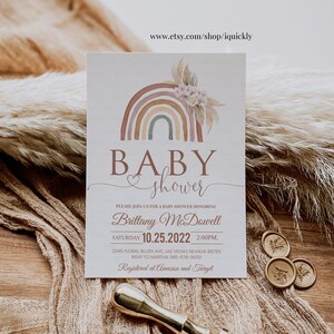 May include: A baby shower invitation with a rainbow and floral design. The invitation says "Baby shower" and includes the date and time of the event, as well as the name of the person being honored, Brittany McDowell. The invitation also includes the address and RSVP information.