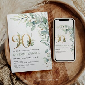 May include: A white invitation card with gold lettering and green watercolor leaves. The card reads "Join us as we celebrate the 90th birthday of Katherine Robinson. Saturday, August 28th | 2:00 PM. Katherine's House, 2345 Floral Blush Ave, Las Vegas, Nevada 98765. RSVP to Marifa 315-678-9000 or mariha@gmail.com".