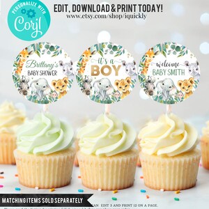 May include: Three round cupcake toppers with a jungle animal theme. The toppers feature a giraffe, elephant, and lion with green leaves and a white background. The text on the toppers reads "Brittany's Baby Shower", "It's a Boy", and "Welcome Baby Smith".