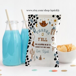 May include: A white chip bag with a black and white cow print pattern. The bag has a thank you message with a cowboy theme and the text "Thanks Y'all for galloping on by to celebrate my first rodeo. Love, Wyatt".