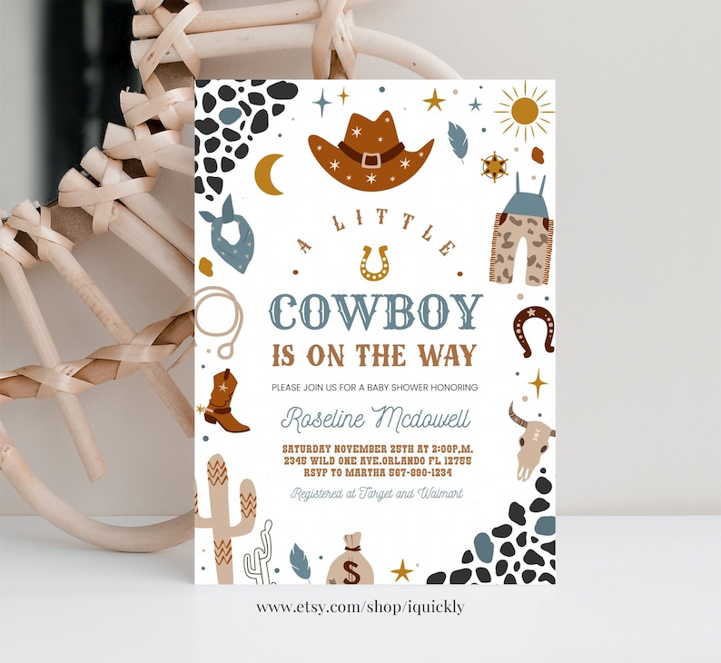 May include: A white baby shower invitation with a cowboy theme. The invitation features a brown cowboy hat, blue bandana, brown cowboy boots, a horseshoe, a cactus, and a sun. The text on the invitation reads "A Little Cowboy is on the Way".