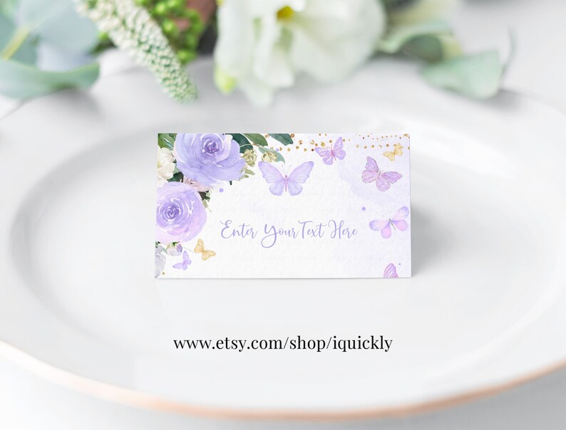 May include: Purple and gold floral place card with butterflies and the text "Enter Your Text Here".
