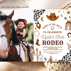 May include: A white invitation with brown, gold, and black accents. The invitation is for a rodeo themed first birthday party. It features a cowboy hat, a horseshoe, a cactus, and a skull. The text on the invitation reads "Saddle Up and Join Us to Celebrate Wyatt's First Rodeo".