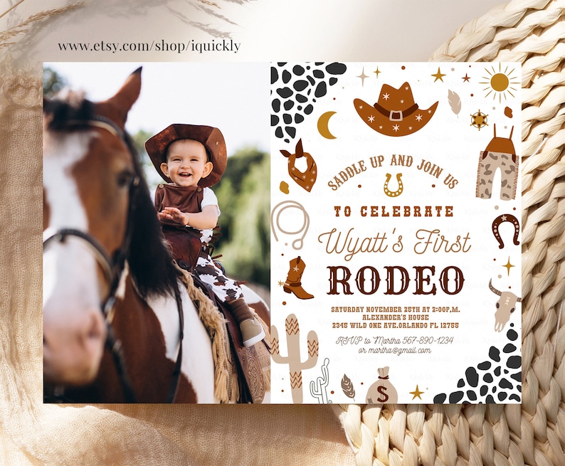 May include: A white invitation with brown, gold, and black accents. The invitation is for a rodeo themed first birthday party. It features a cowboy hat, a horseshoe, a cactus, and a skull. The text on the invitation reads "Saddle Up and Join Us to Celebrate Wyatt's First Rodeo".