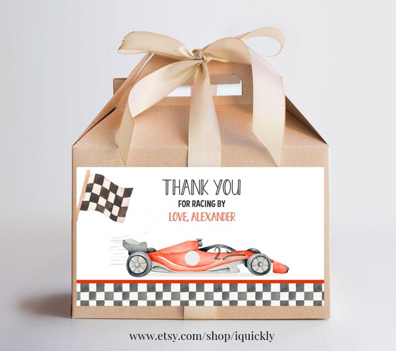 May include: A thank you favor box with a white label that says "Thank You for Racing by Love, Alexander". The label also features a checkered flag, a red race car, and a checkered pattern border.
