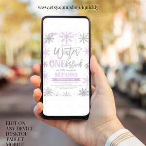 May include: A smartphone displaying a winter-themed invitation. The invitation features the text "Winter ONEderland" with snowflake and glitter accents. The invitation includes event details and the text "Edit on any device desktop tablet mobile."
