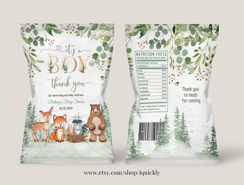May include: A baby shower favour bag with a woodland theme. The bag is white with green foliage and a gold 'It's a Boy' design. The front of the bag features a deer, fox, raccoon, and bear. The back of the bag has a nutrition facts label with a humorous list of baby shower essentials. The bag also includes the text 'Thank you so much for coming'.