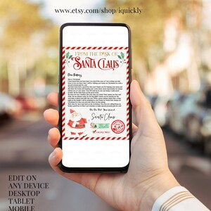 May include: A smartphone displays a Christmas-themed letter from Santa Claus. The letterhead reads "From the Desk of Santa Claus" with festive red and green accents. The bottom of the letter features a Santa Claus illustration and the text "Nice List Approved."