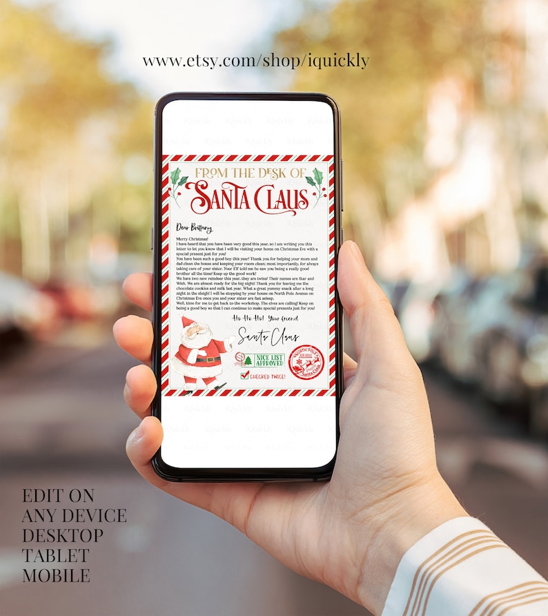 May include: A smartphone displays a Christmas-themed letter from Santa Claus. The letterhead reads "From the Desk of Santa Claus" with festive red and green accents. The bottom of the letter features a Santa Claus illustration and the text "Nice List Approved."
