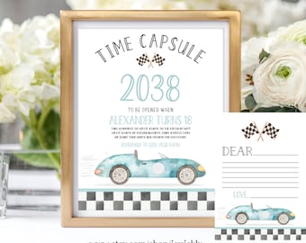 May include: A printable time capsule sign with a blue race car and checkered flag design. The sign says "Time Capsule 2038 To Be Opened When Alexander Turns 18".