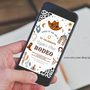 May include: A digital invitation for a rodeo themed first birthday party. The invitation features a cowboy hat, boots, a horseshoe, and a cactus. The text on the invitation reads "Saddle Up and Join Us to Celebrate Wyatt's First Rodeo".