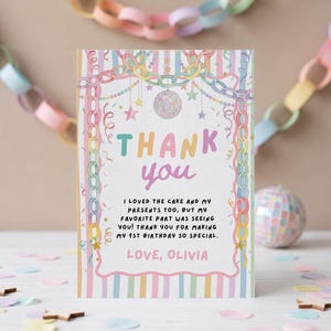 May include: A rectangular thank you card featuring pastel striped borders, a disco ball illustration, and hanging paper chain decorations. The text reads: THANK YOU, I LOVED THE CAKE AND MY PRESENTS TOO, BUT MY FAVORITE PART WAS SEEING YOU! THANK YOU FOR MAKING MY 1ST BIRTHDAY SO SPECIAL. LOVE, OLIVIA.