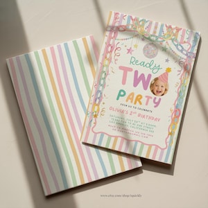 May include: A rectangular birthday invitation card featuring pastel vertical stripes and a decorative border of colorful paper chains. The text reads Ready TWO PARTY, Olivia's 2nd Birthday, with event details and a circular photo of a child in a party hat.