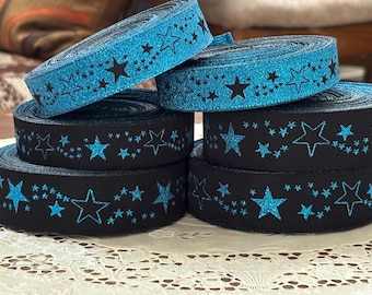 Nastro jacquard con stelle metalliche: poliestere reversibile blu e nero