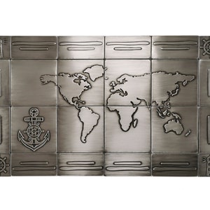 May include: A rectangular metal wall art piece featuring a world map design. The artwork is composed of square tiles with nautical-themed accents, including anchors, ship wheels, and lighthouses. The color is a muted silver.