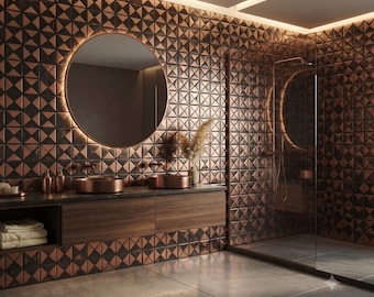 May include: A bathroom interior featuring copper-toned geometric wall tiles, a circular backlit mirror, and a dark wood vanity with two copper vessel sinks. A glass-enclosed shower stall is positioned to the right with matching copper fixtures.