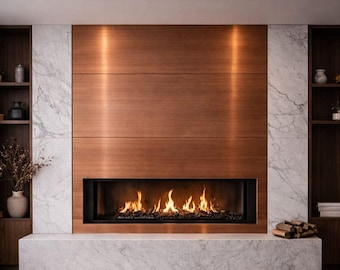 May include: A linear fireplace set within a large copper-toned panel, flanked by white marble columns and dark wood shelving units. The fireplace features a bed of dark stones with active orange flames burning inside the hearth.
