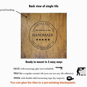 May include: Back view of a wooden tile with a brown woodgrain finish. The tile has a circular logo with the text "COPPER & CRAFT" and "THIS PRODUCT IS 100% HANDMADE" with five stars. The text "www.COPPERANDCRAFT.COM" is below the stars. The tile has a special backing and can be mounted in three ways: glue, tile, or stick.