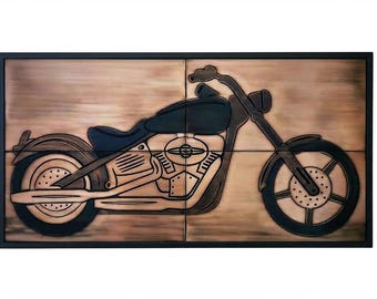May include: A rectangular wall art piece featuring a copper-toned metal relief of a motorcycle. The design showcases a dark-colored fuel tank, seat, and wheels against a brushed copper background, all enclosed within a thin black frame.