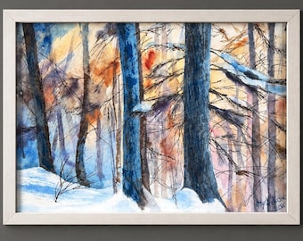 May include: A framed watercolor painting depicting a winter forest scene with dark blue tree trunks, bare branches, and snow-covered ground. The background features warm orange and yellow light filtering through the trees. The artist signature is visible.