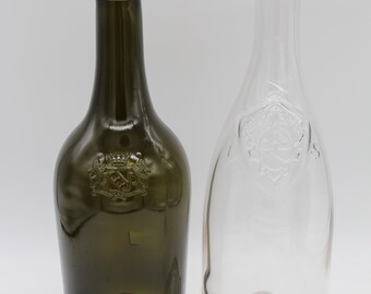 Enchanting ensemble of heavy glass vases made from vintage bottles with embedded coats of arms