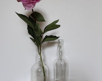 Enchanting ensemble of heavy glass vases made from vintage whiskey bottles