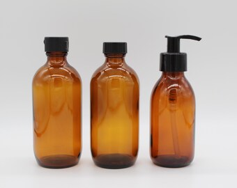Noble glass bottle trio in apothecary style, vintage
