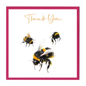 May include: A white card with a pink border and the text "Thank You" in orange script. Three bumblebees are illustrated on the card, one large bumblebee in the centre and two smaller bumblebees on either side.