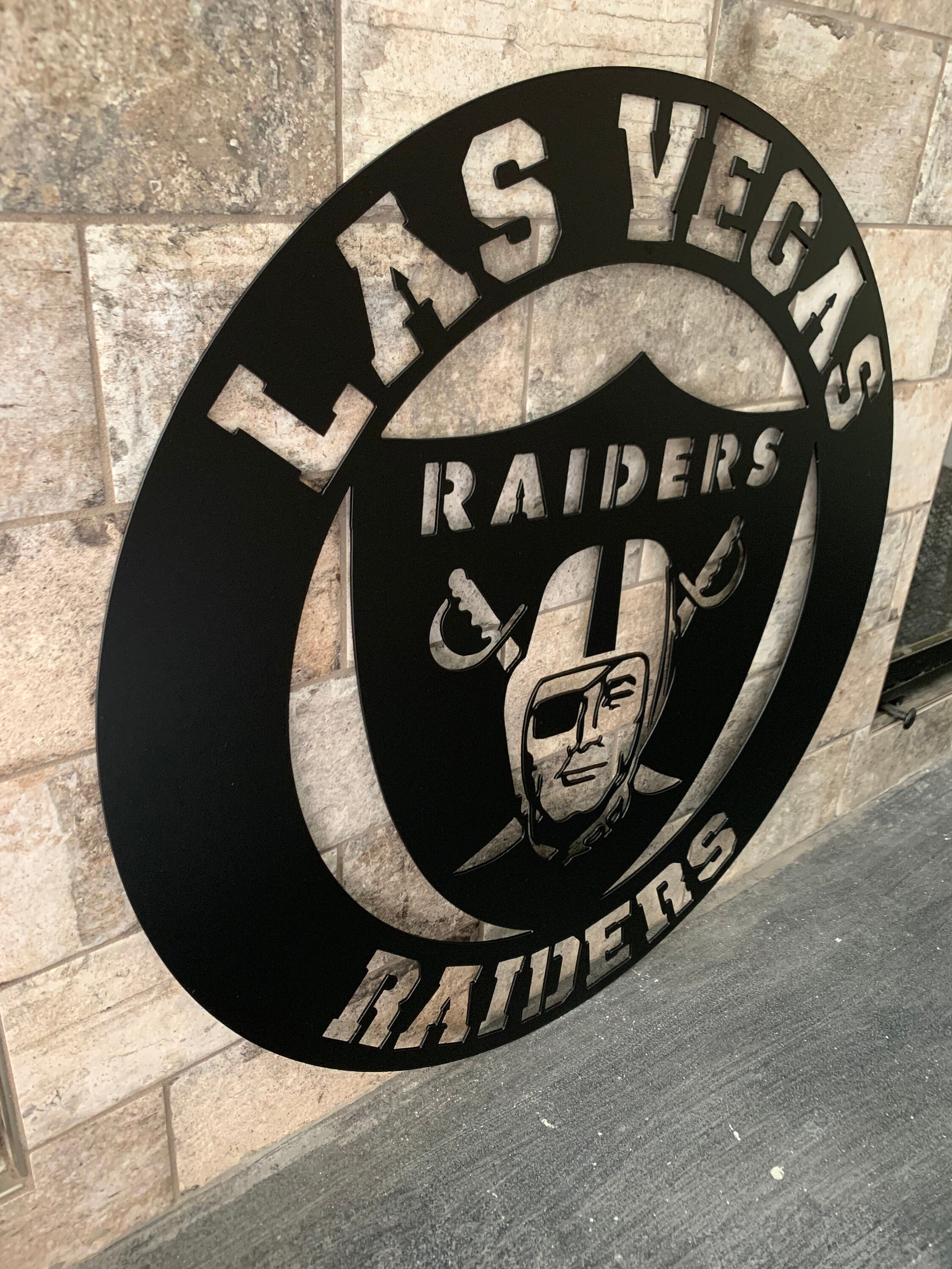 lv raiders tin sign